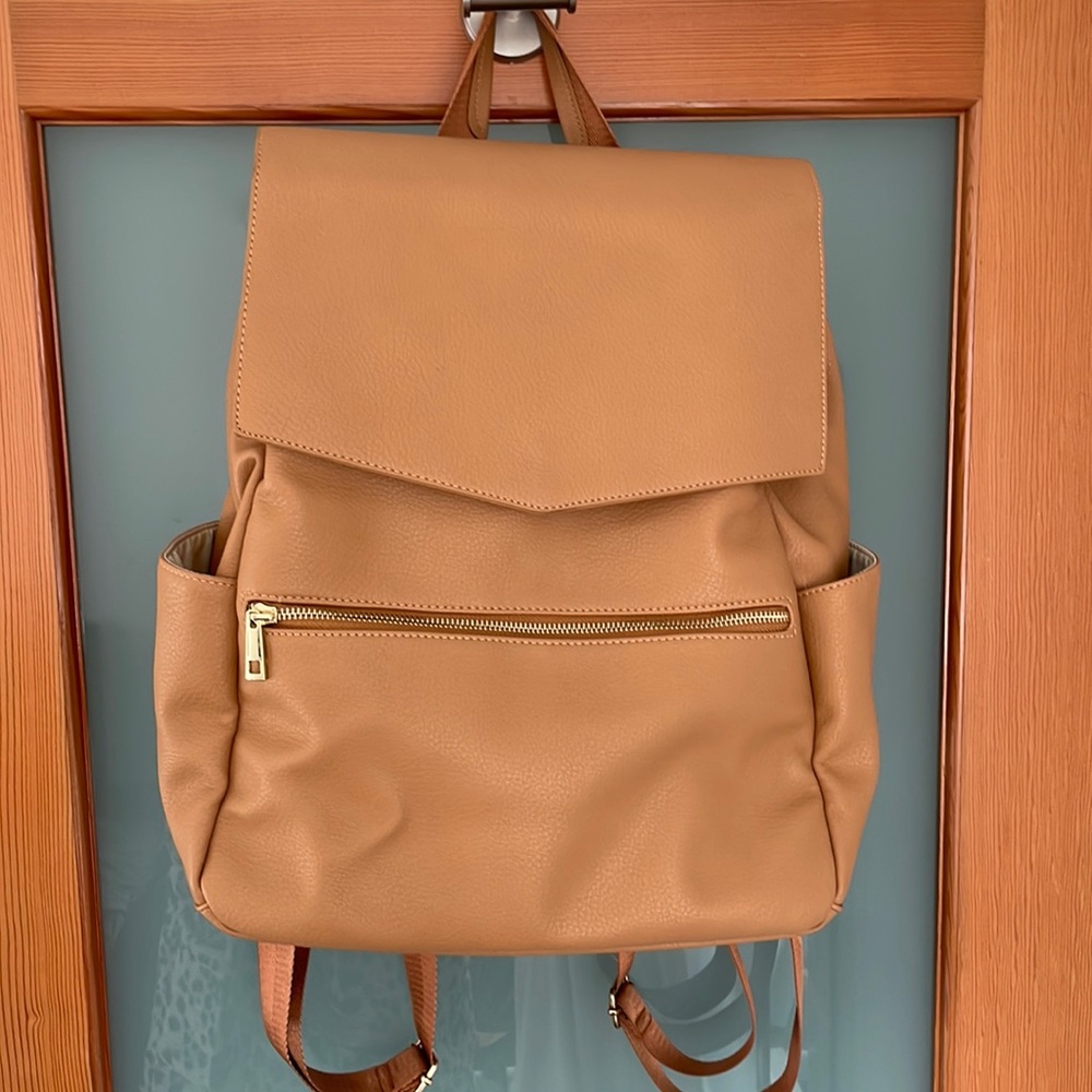 Leather diaper bag. Comes with changing pad.